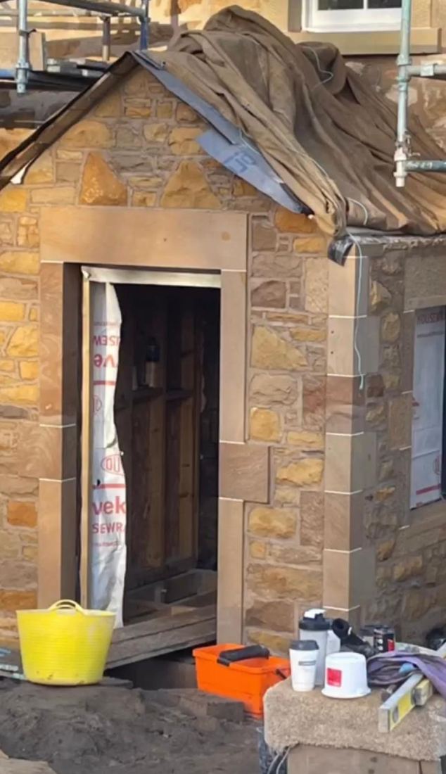 Carved sandstone window surround